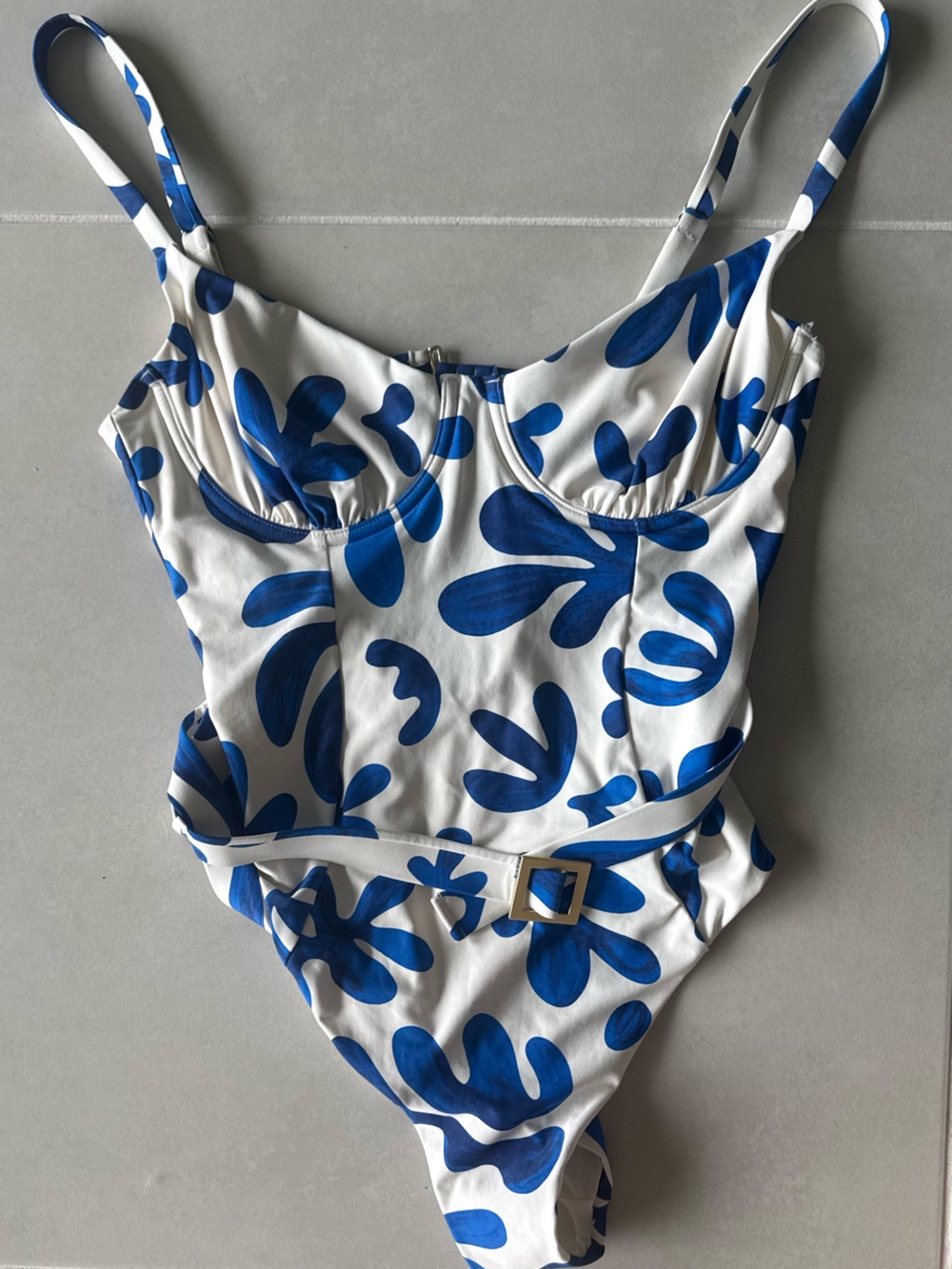 NEVER WORN WeWoreWhat White One-Piece with Bold Blue Floral Print and Belt
